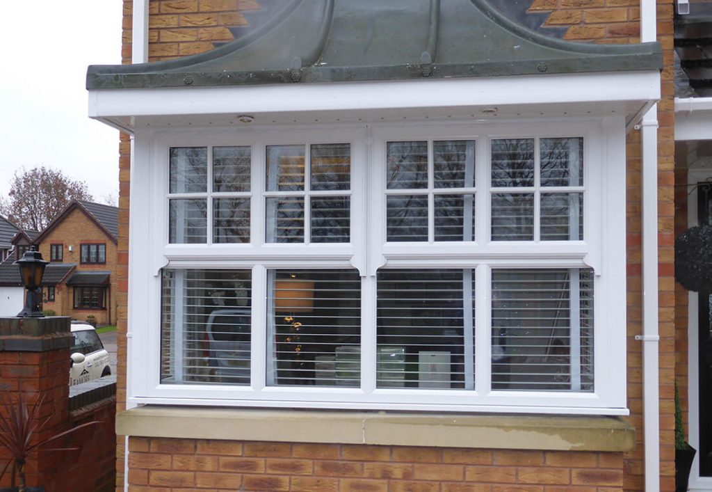 White uPVC mock sash horn casement windows